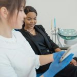 Patient talking with dentist about a tooth emergency at Crystal Lake Family Dentist in Leander